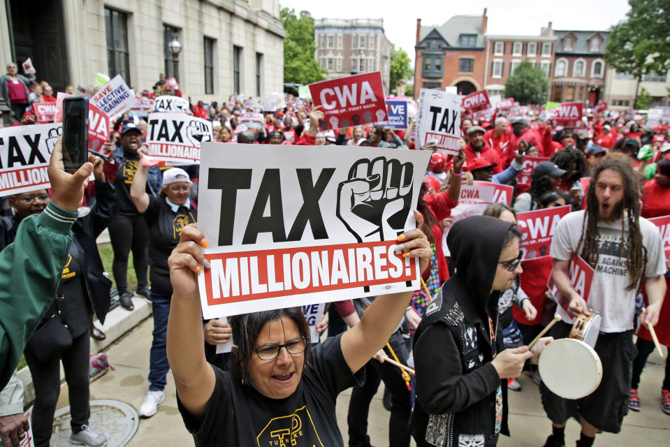 Protesters rally against benefit cuts in Trenton, N.J., Thursday, June 13, 2019. Spurred on by a tweet from U.S. Sen. Bernie Sanders, thousands of union members crowded around New Jersey's legislative annex Thursday, even spilling into the street, to protest state Senate President Steve Sweeney's calls to cut some worker benefits. (AP Photo/Seth Wenig)