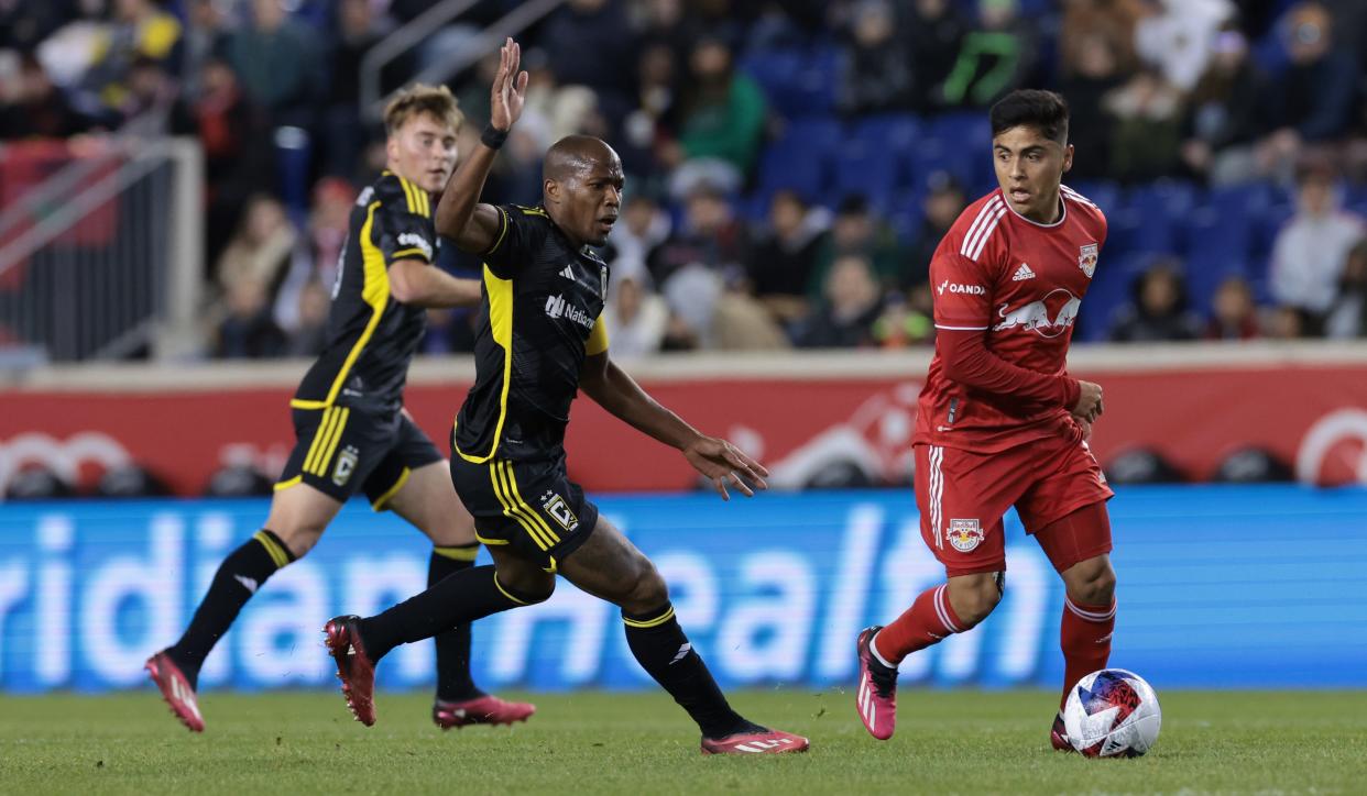 Mar 18, 2023; Harrison, New Jersey, USA; New York Red Bulls midfielder Frankie Amaya (8) passes the ball against Columbus Crew midfielder Darlington Nagbe (6) at Red Bull Arena. Mandatory Credit: Vincent Carchietta-USA TODAY Sports