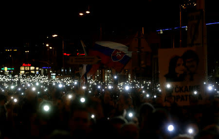 Demonstrators light up their mobile phones as they take part in a protest rally marking the first anniversary of the murder of the investigative reporter Jan Kuciak and his fiancee Martina Kusnirova in Bratislava, Slovakia, February 21, 2019. REUTERS/David W. Cerny