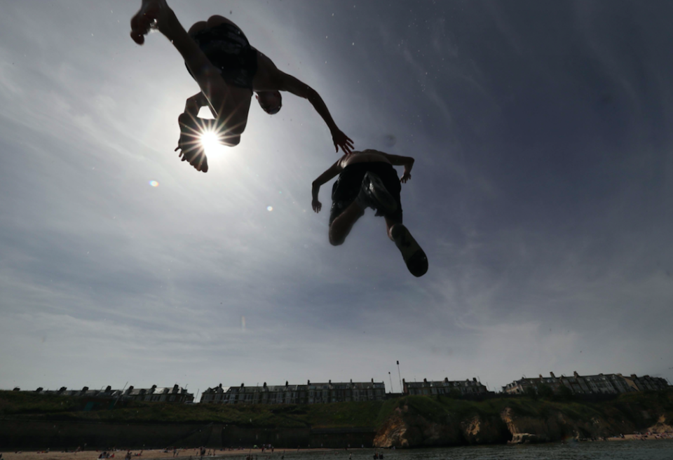 <em>People enjoying the heatwave today on Cullercoats beach on North Tyneside (PA)</em>