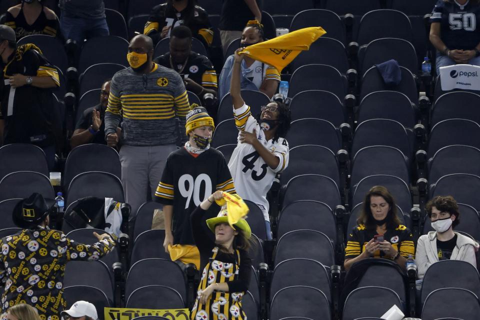 Pittsburgh Steelers fans cheer on their team late in the second half of an NFL football game against the Dallas Cowboys in Arlington, Texas, Sunday, Nov. 8, 2020. (AP Photo/Ron Jenkins)