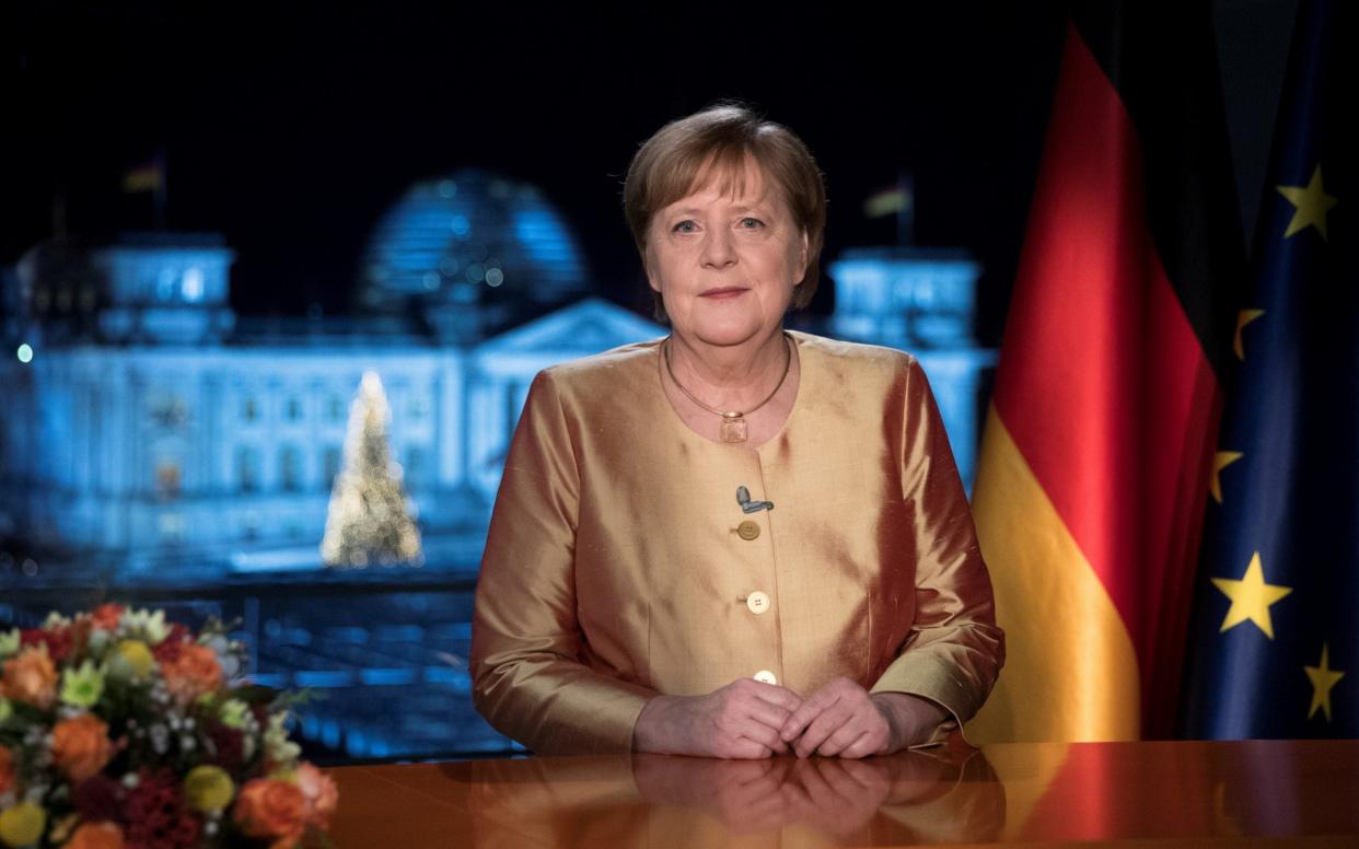 German Chancellor Angela Merkel poses for photographs after the television recording of her annual New Year's speech at the chancellery in Berlin, Germany December 30, 2020. Picture taken December 30, 2020. Markus Schreiber/Pool via REUTERS. -  POOL/REUTERS