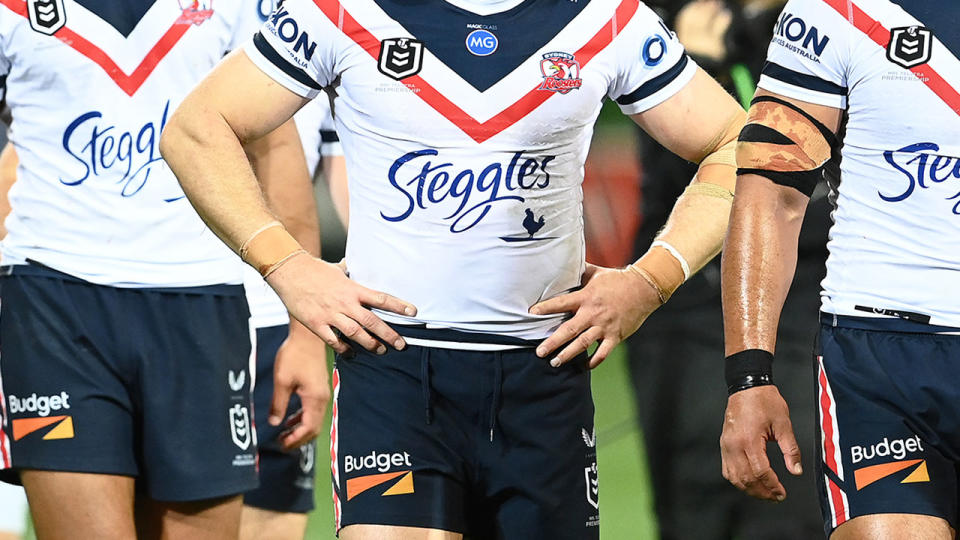 Seen here, Roosters players stand together during an NRL match.
