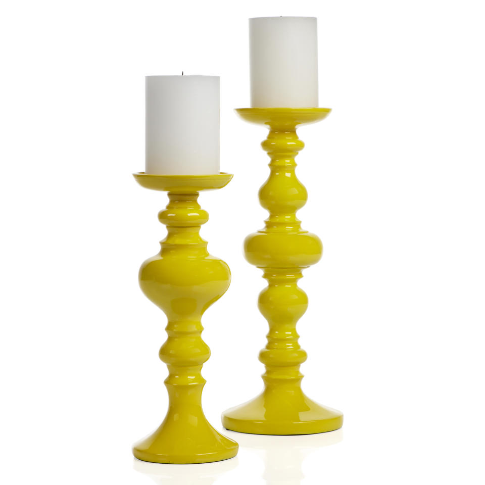 This undated publicity photo provided by Z Gallerie shows a pair of Mariposa candleholders. Bright neon yellow accessories add a punch of color to spring decor. Offset the intensity with crisp white or darker hues that will simultaneously tone them down while showing them off (www.zgallerie.com). (AP Photo/Z Gallerie, TSK Photography)