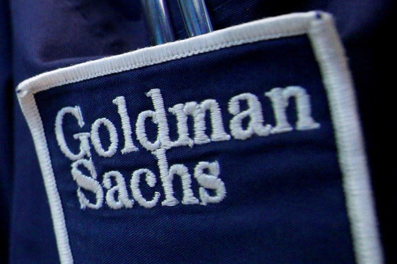 The logo of Dow Jones Industrial Average stock market index listed company Goldman Sachs (GS) is seen on the clothing of a trader working at the Goldman Sachs stall on the floor of the New York Stock Exchange