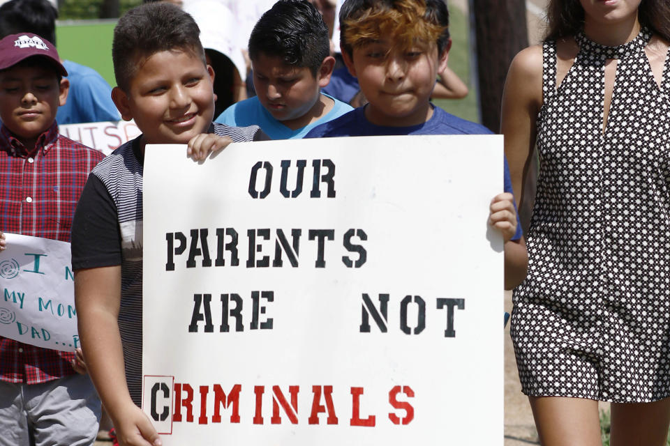 In this Aug. 11, 2019 photo, children of mainly Latino immigrant parents hold signs in support of migrant workers picked up during an immigration raid at a food processing plant, during a protest march to the Madison County Courthouse in Canton, Mississippi. (Photo: ASSOCIATED PRESS)