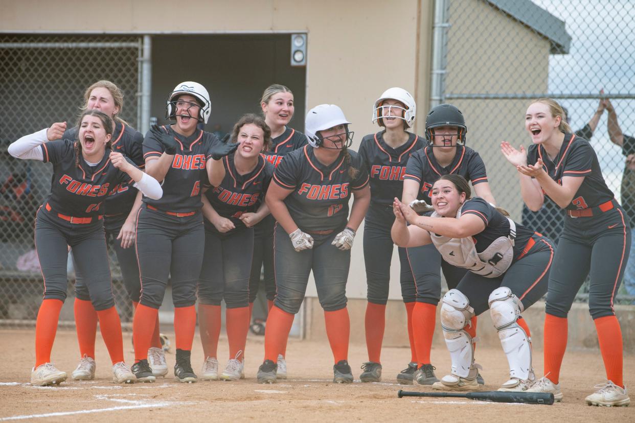 The Silverton softball team waits for their teammate Jerisha Perez (2) to celebrate after scoring runs during a league matchup at Silverton High School on Wednesday, April 24, 2024, in Silverton, Ore.