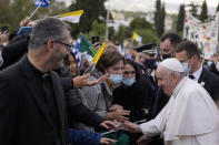 Pope Francis visits Saint Dionysius School of the Ursuline Sisters in Athens, Greece, Monday, Dec. 6, 2021. Francis' five-day trip to Cyprus and Greece has been dominated by the migrant issue and Francis' call for European countries to stop building walls, stoking fears and shutting out "those in greater need who knock at our door." (AP Photo/Thanassis Stavrakis, Pool)