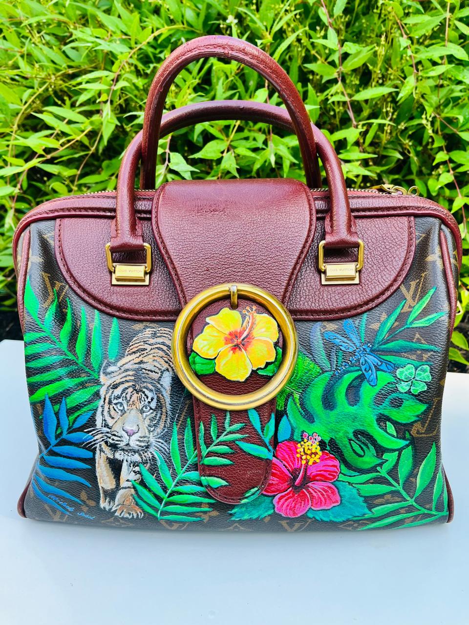 One of Michele Sobel's painting work on a bag, which includes a tigress