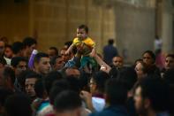 Egyptians wait outside a hospital to retreive some of the bodies of the victims of the May 26, 2017 bus attack that killed 28 Coptic Christian pilgrims