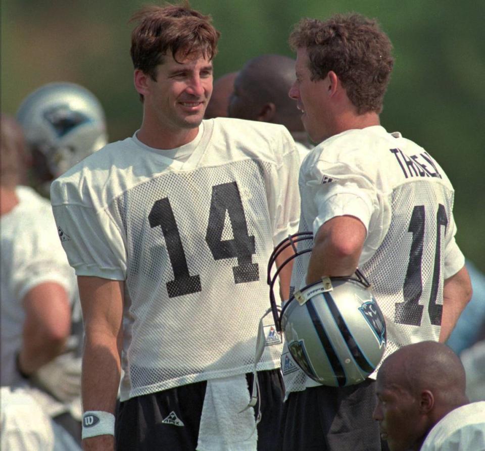 8/15/95: Quarterbacks Frank Reich (14) and Jack Trudeau talk Monday after coach Dom Capers informed each of his decision about the starter. Capers chose Reich because he led the Panthers to their only two touchdowns in three exhibitions.