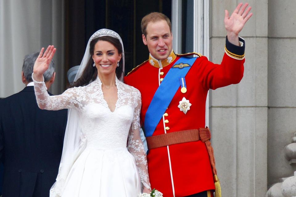 Prince William and his wife Kate wave to the crowd from the balcony of Buckingham Palace after their wedding at Westminster Abbey (PA Archive)