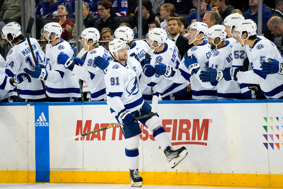 Tampa Bay Lightning center Steven Stamkos (91) is congratulated after scoring against the New York Rangers during the second period of an NHL hockey game Tuesday, Oct. 11, 2022, in New York. (AP Photo/Julia Nikhinson)