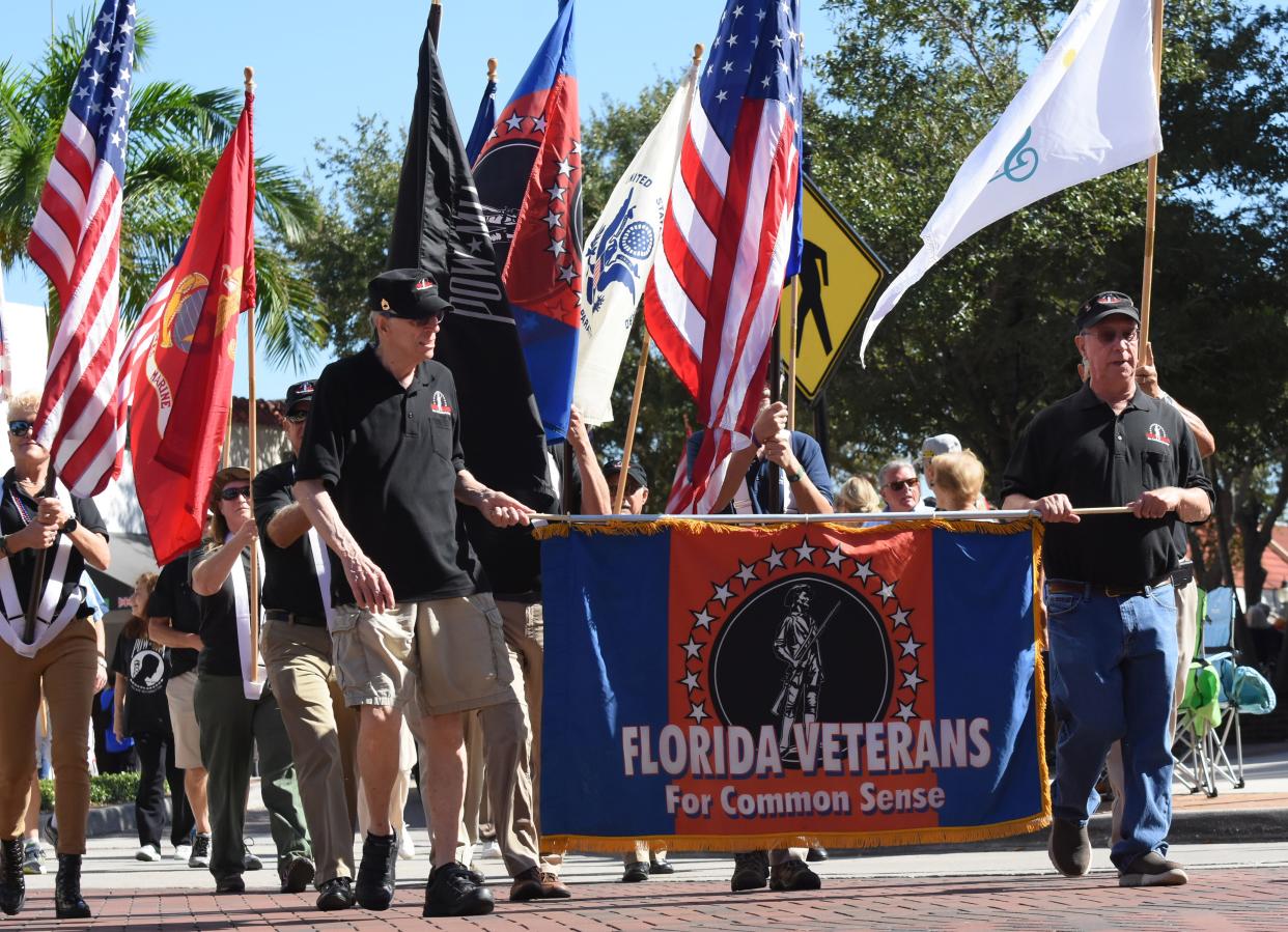Florida Veterans for Common Sense walk in the 2019 Veterans Day Parade on Main Street in Sarasota. The non-profit's president praised a plan to build affordable housing  for veterans at Tuesday's City Commission meeting.