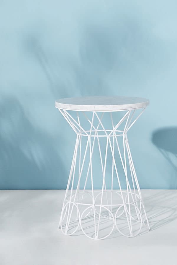 Get it from <a href="https://www.anthropologie.com/shop/ancer-indooroutdoor-side-table?category=furniture-end-tables&amp;color=010" target="_blank">Anthropologie</a>.&nbsp;