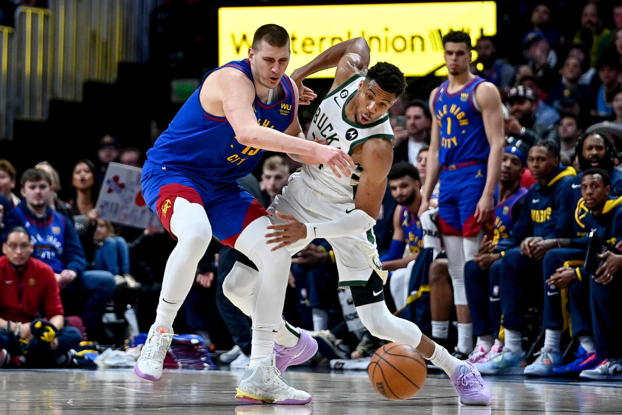 Nikola Jokić and Giannis Antetokounmpo could make significant leaps in The Bill Russell Scale with standout performances in the 2023-24 NBA season. (Photo by Dustin Bradford/Getty Images)