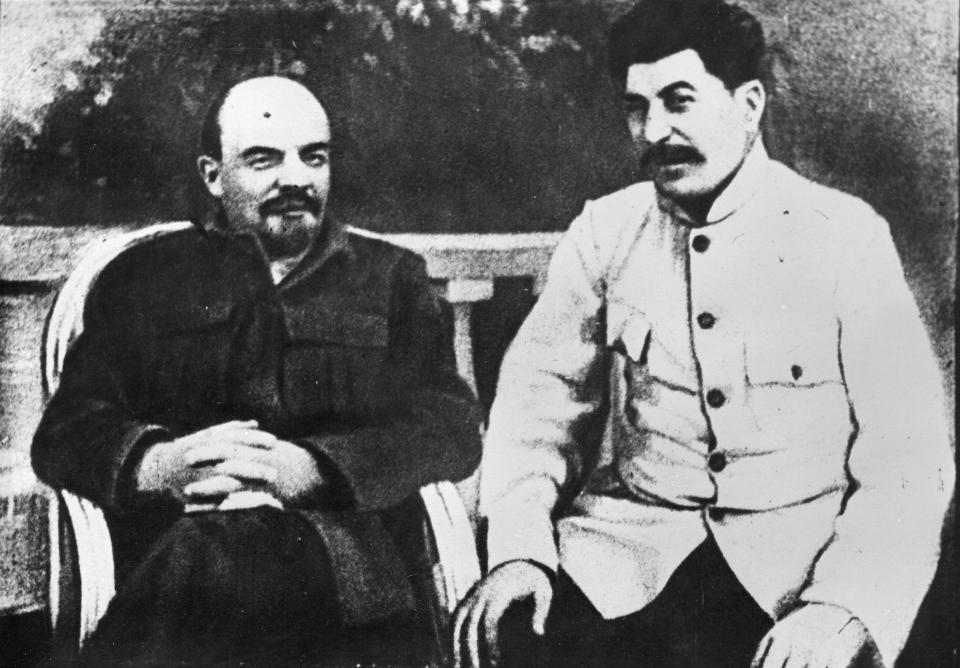 FILE - Soviet founder Vladimir Lenin, left, and Soviet leader Josef Stalin sit in a park at Gorki residence in 1922 just outside Moscow, Russia. With its brutality, technological accomplishments and rigid ideology, the Soviet Union cast a huge shadow on the world like that of a colossus that would loom forever. Lenin was already in poor health when the USSR was formed and he died of a stroke little more than a year later. Josef Stalin outmaneuvered rivals in the ensuing battle for power. (AP Photo, File)