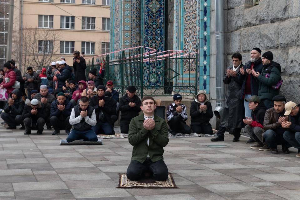 Muslims pray on the street during the celebration of Eid al-Fitr near the Cathedral Mosque in St. Petersburg, Russia, April 10, 2024. Thousands of people have gathered for the festive prayers in mosques and prayer rooms in St. Petersburg and other cities and towns around the world. (Andrei Bok/SOPA Images/LightRocket via Getty Images)