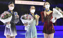 Mai Mihara of Japan, centre, who finished in first place, Haein Lee of South Korea, second placed, left, Yelim Kim of South Korea, who finished third, pose with their medals after the women free skating program during the ISU Four Continents Figure Skating Championships in Tallinn, Estonia, Saturday, Jan. 22, 2022. (AP Photo/Sergei Stepanov)