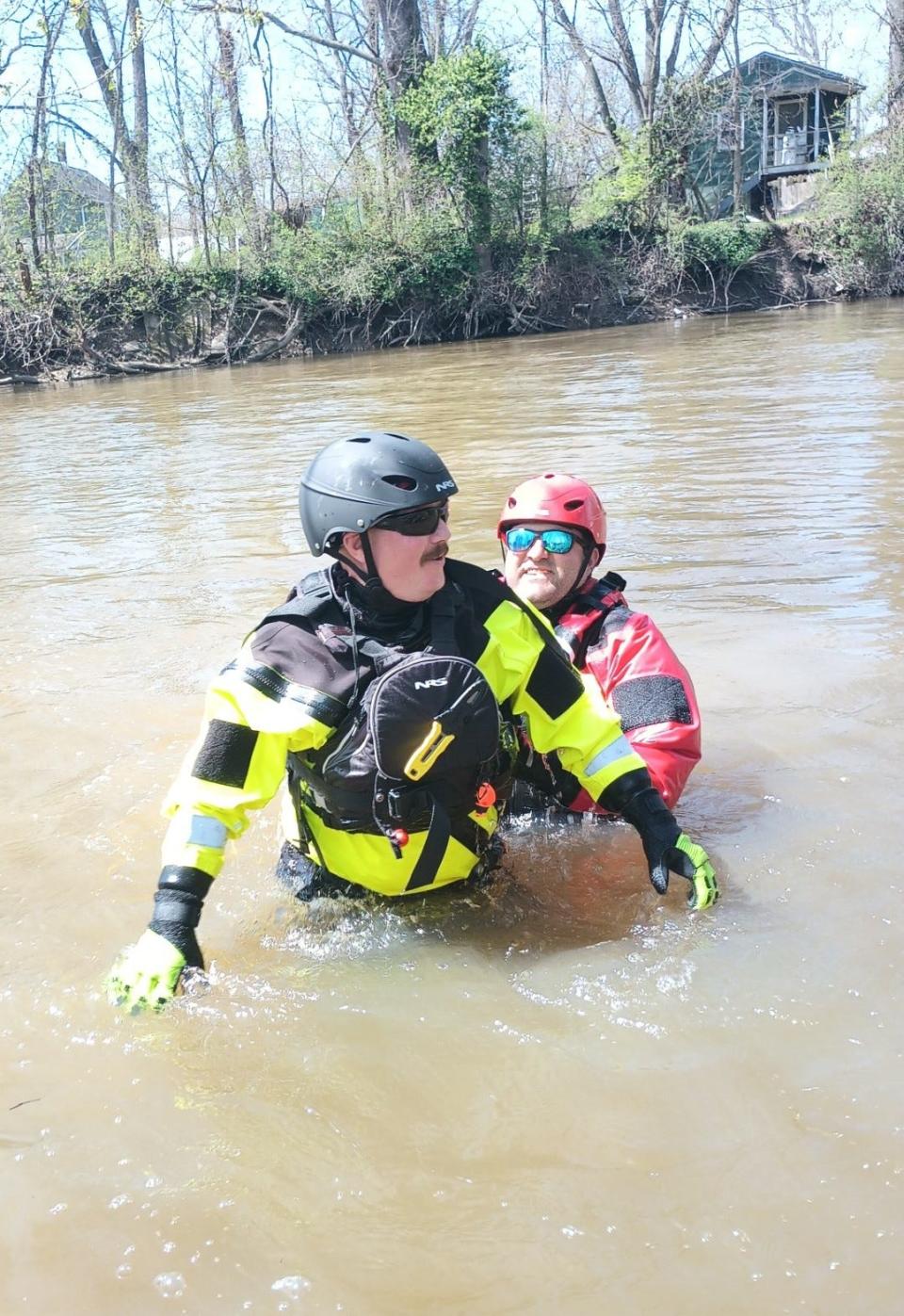 Jackson Township firefighter Shawn Parsell, left, and Massillon firefighter Matt Tasz conclude a victim-contact rescue  in the Tuscarawas River.