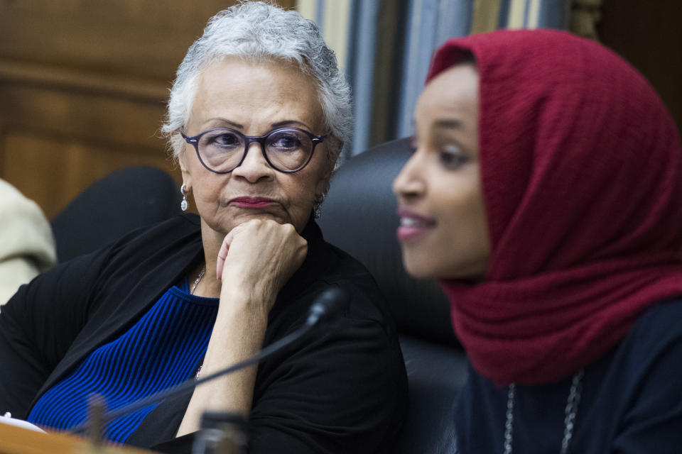 Reps. Bonnie Watson Coleman, D-N.J., left, and Ilhan Omar, D-Minn.