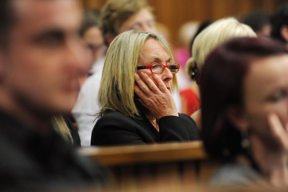 June Steenkamp, mother of the late Reeva Steenkamp, listens as state prosecutor Gerrie Nel questions Oscar Pistorius, in court in Pretoria, South Africa, Thursday, April 10, 2014. Pistorius is charged with the murder of his girlfriend Steenkamp, on Valentines Day in 2013. (AP Photo/Werner Beukes, Pool)