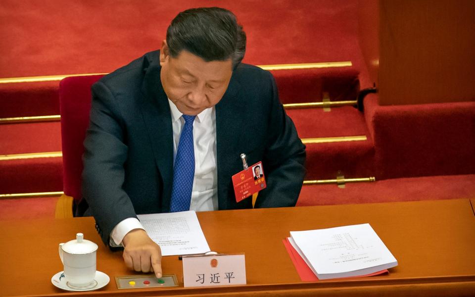 Xi Jinping voting to sign the security bill into law. The West says it will destroy Hong Kong's independence from Beijing - AP