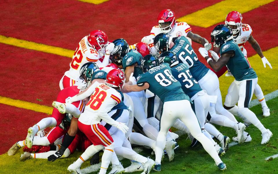 Philadelphia Eagles quarterback Jalen Hurts (1) scores a touchdown on a quarterback sneak against the Kansas City Chiefs during the first quarter in Super Bowl LVII at State Farm Stadium in Glendale on Feb. 12, 2023.