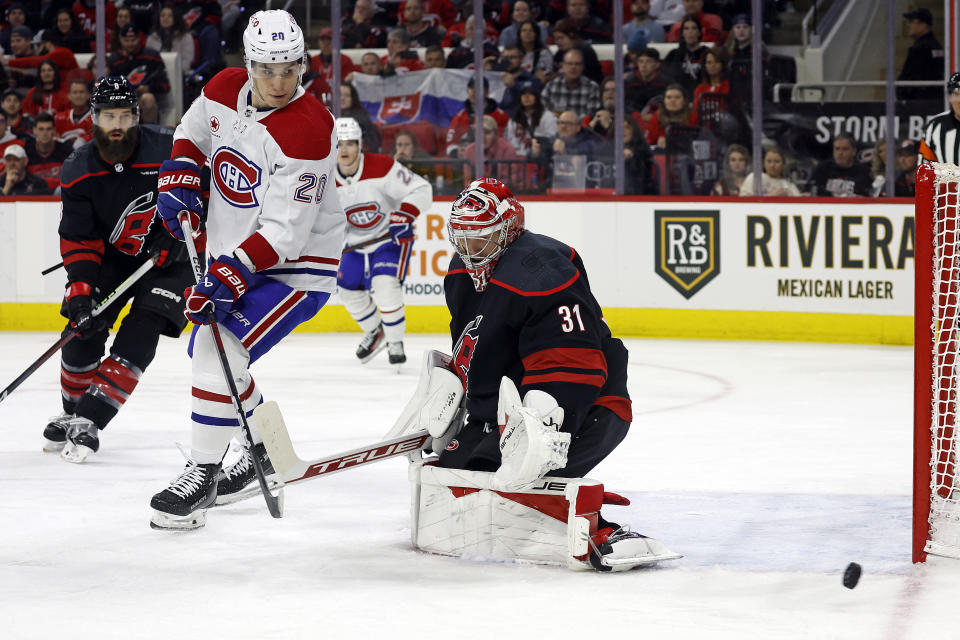 Montreal Canadiens' Juraj Slafkovsky (20) watches as the puck goes past Carolina Hurricanes goaltender Frederik Andersen (31) and the net during the first period of an NHL hockey game in Raleigh, N.C., Thursday, March 7, 2024. (AP Photo/Karl B DeBlaker)