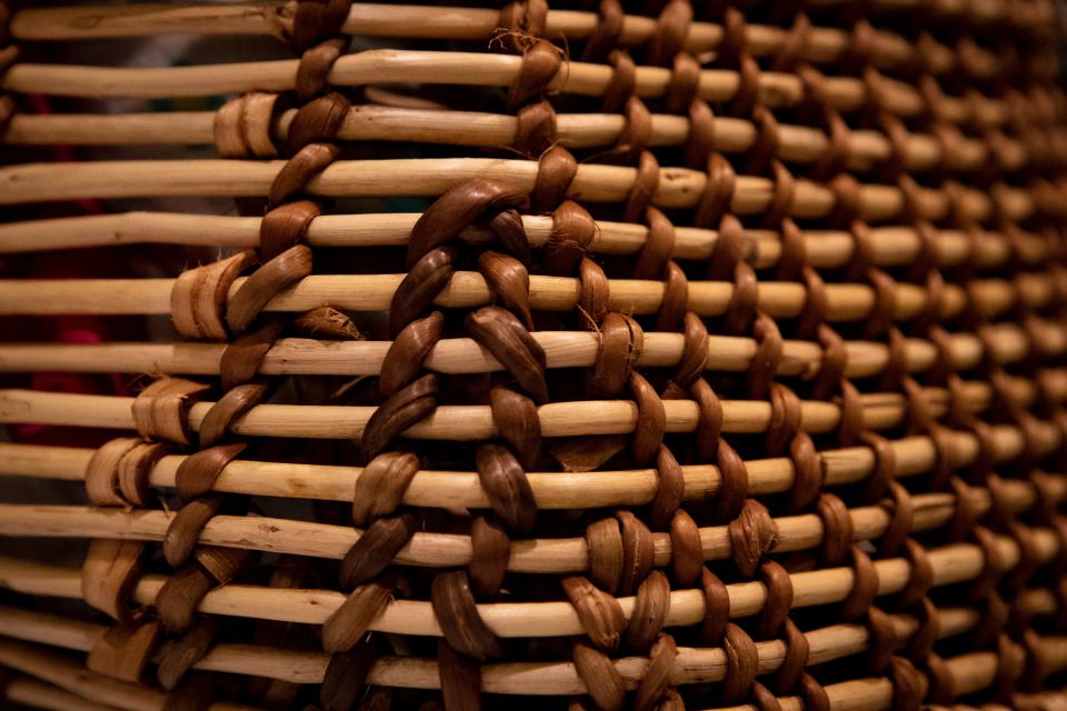 Sticks intertwine on a carefully hand woven baby basket in Stephanie Craig's collection.