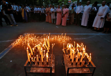 FILE PHOTO: People attend a prayer meeting after lighting candles to show solidarity with the victims of Sri Lanka's serial bomb blasts, outside a church in Kolkata, India, April 23, 2019. REUTERS/Rupak De Chowdhuri