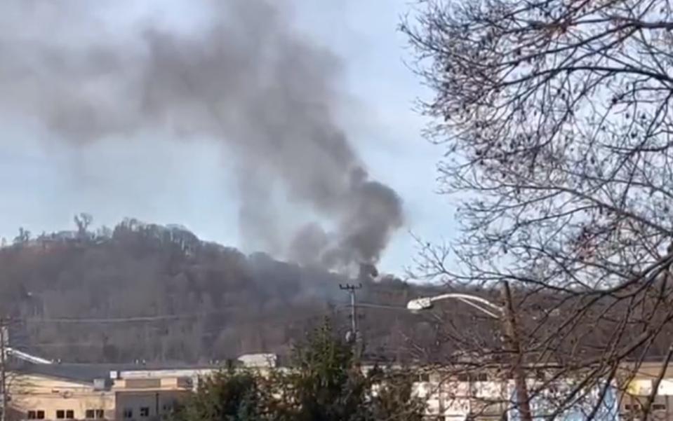 Smoke can be seen from a house explosion in Crescent Township.