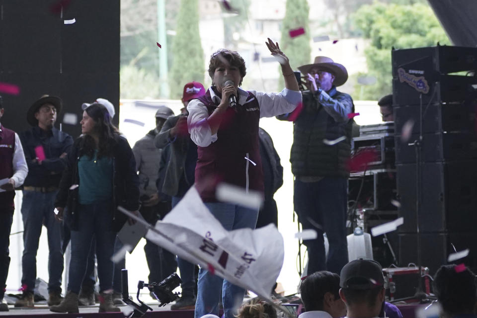 Delfina Gomez, left, MORENA political party gubernatorial candidate, speaks to the crowd during a campaign rally in Valle de Chalco, Mexico, Sunday, May 28, 2023. Voters in the state of Mexico go to the polls on June 4 to elect a new governor. (AP Photo/Marco Ugarte)