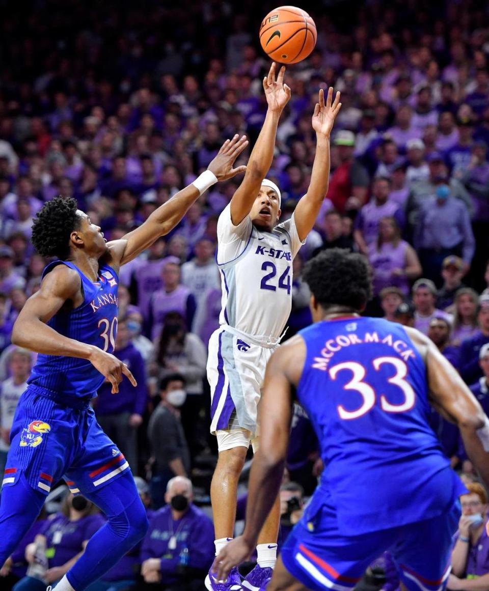 K-State’s Nijel Pack shoots over KU’s Ochai Agbaji and David McCormack during the first half of Saturday’s Big 12 Conference game at Bramlage Coliseum. Pack had 22 points in the opening half and 35 in the game.