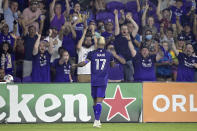 Orlando City forward Nani (17) celebrates with fans after scoring a goal during the second half of an MLS soccer match against Atlanta United, Friday, July 30, 2021, in Orlando, Fla. (Phelan M. Ebenhack/Orlando Sentinel via AP)