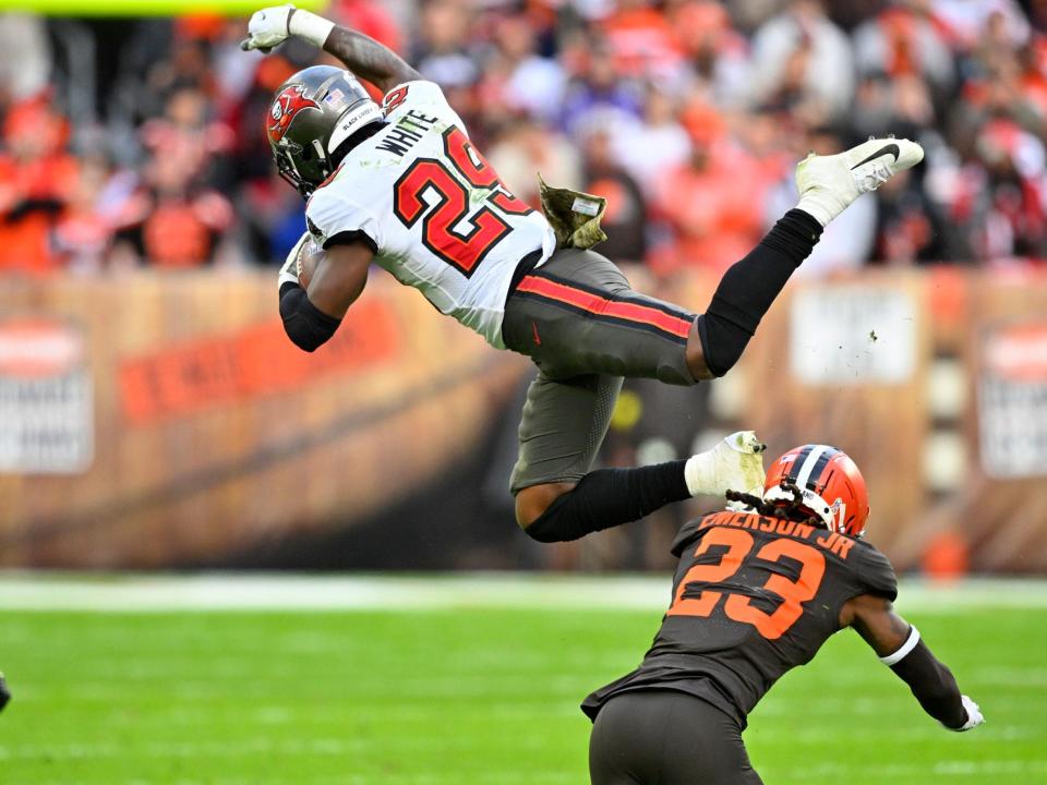 Rachaad White goes airborne against the Cleveland Browns.