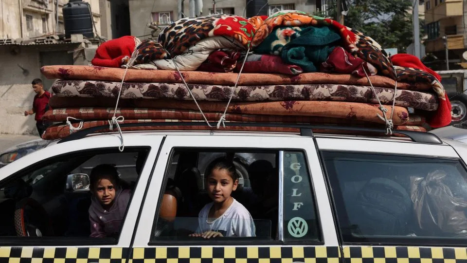 Children sit in a car in Khan Yunis refugee camp in southern Gaza on October 28, 2023, amid the ongoing battles between Israel and the Palestinian group Hamas. - Mohammed Abed/AFP/Getty Images