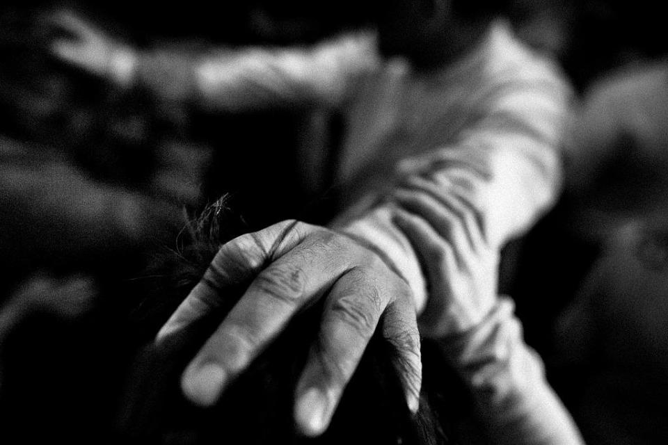 hands of a person outstretched during a ritual