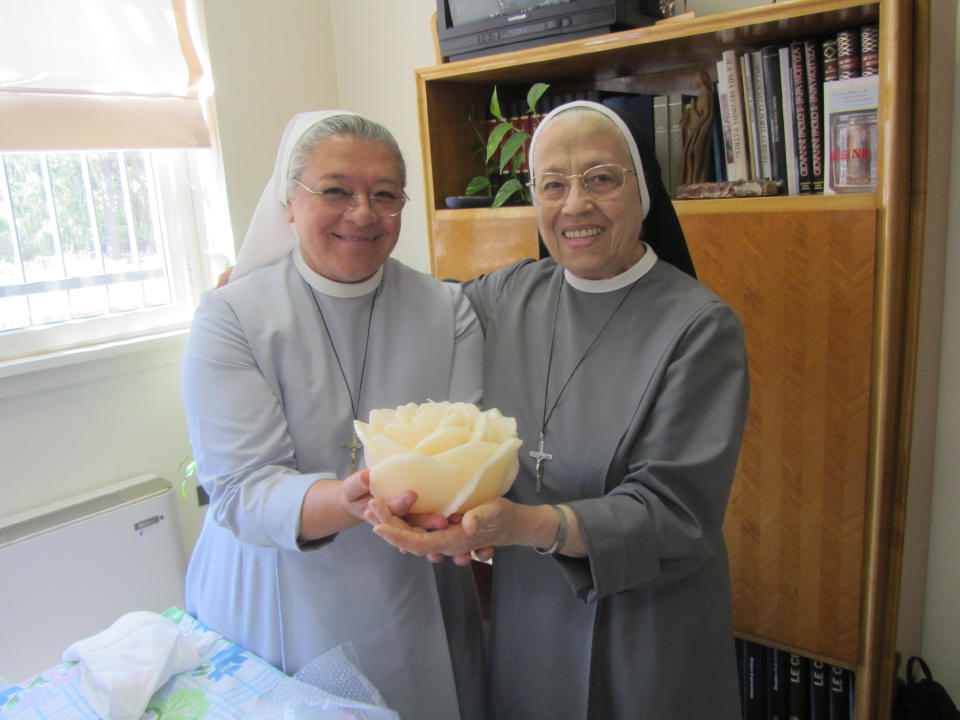 This undated photo provided by Sister Maria Mabel Spagnuolo shows her, left, with Sister Maria Ortensia Turati. On March 16, 2020, Turati, who was the former mother general of the Little Missionary Sisters of Charity in Tortona, Italy, died at age 88 as a result of the COVID-19 coronavirus. (Courtesy Sister Maria Mabel Spagnuolo via AP)