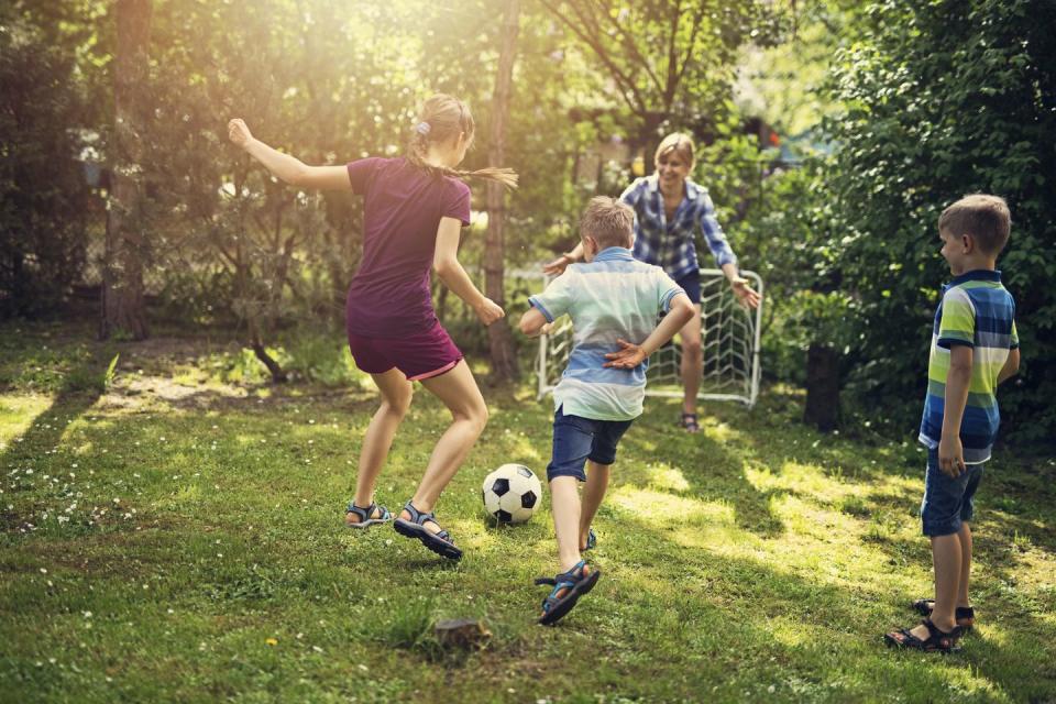 4th of july activities  family playing soccer