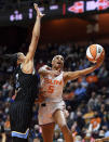 Connecticut Sun guard Jasmine Thomas puts up a shot as Chicago Sky Candace Parker defends during a WNBA semifinal playoff basketball game, Tuesday, Sept. 28, 2021, at Mohegan Sun Arena in Uncasville, Conn. (Sean D. Elliot/The Day via AP)