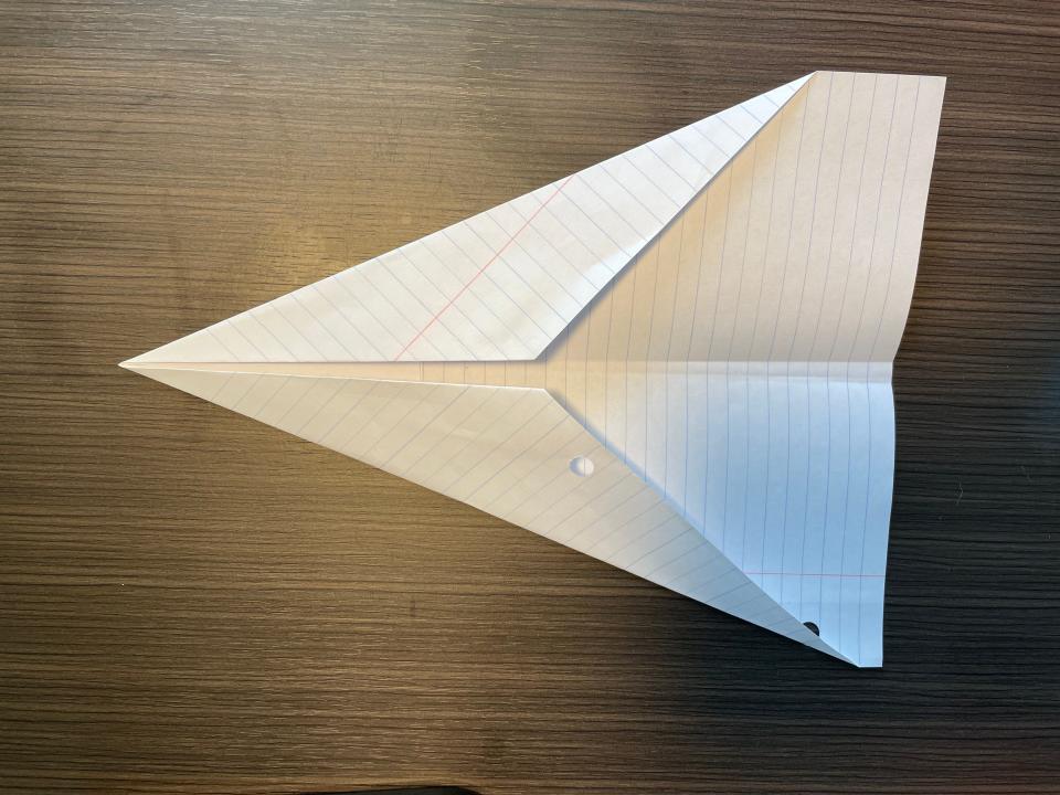 How to make a paper airplane step three