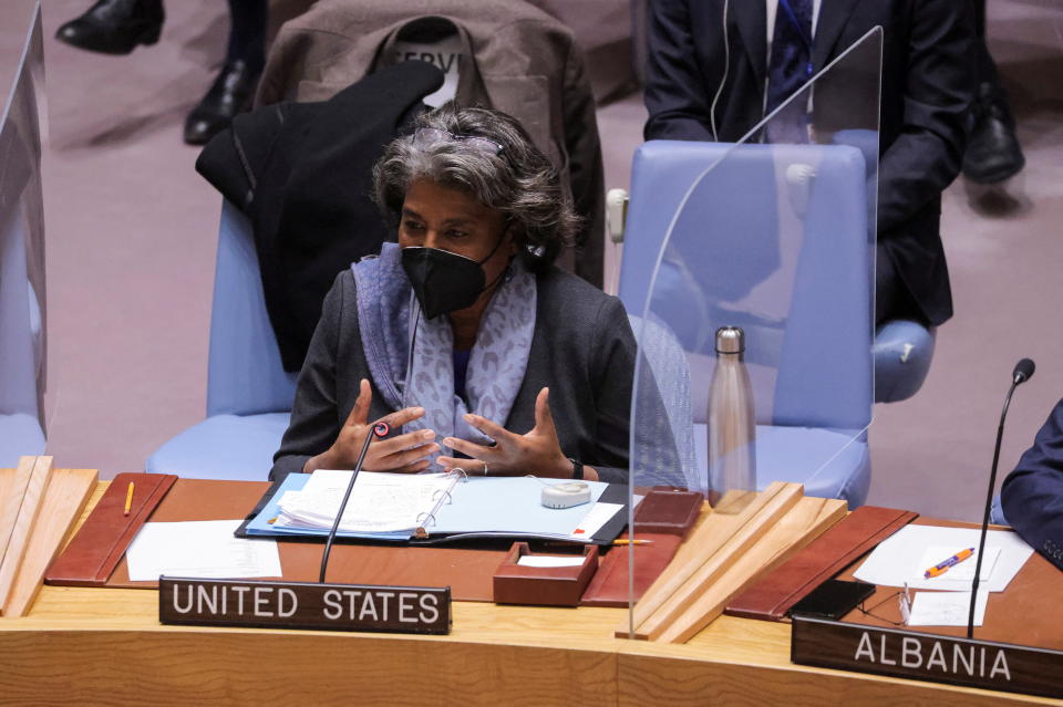 U.S. Ambassador to the United Nations Linda Thomas-Greenfield, wearing a face mask, sits at a table with a microphone and a placard reading: United States.