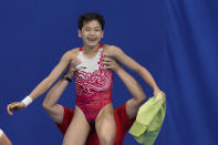 Quan Hongchan of China celebrates after competing in women's diving 10-meter platform final at the 2020 Summer Olympics, Thursday, Aug. 5, 2021, in Tokyo, Japan. (AP Photo/Alessandra Tarantino)