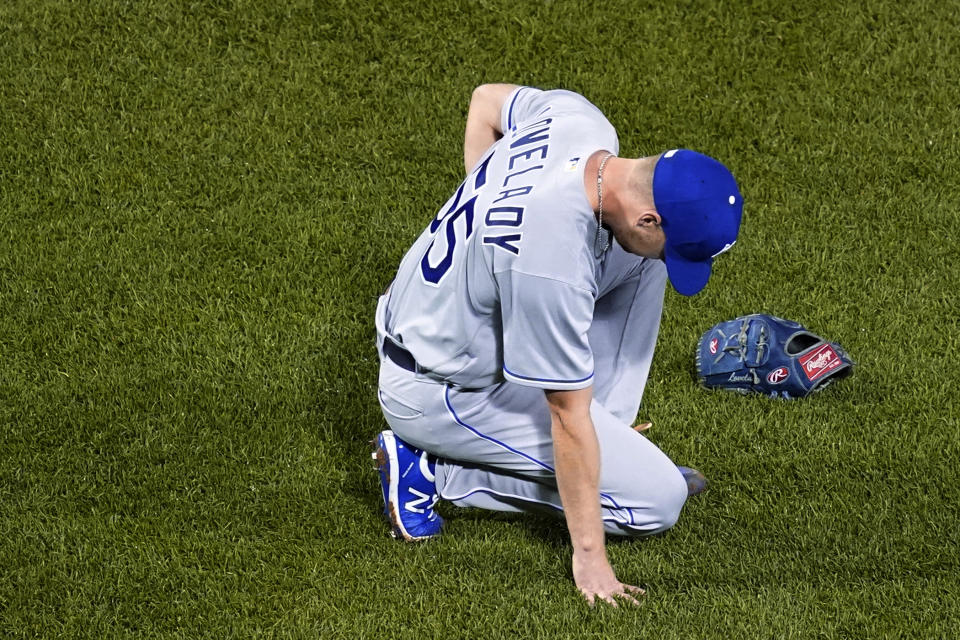 Kansas City Royals relief pitcher Richard Lovelady reacts after he hurt himself while fielding a groundout by Boston Red Sox's J.D. Martinez during the seventh inning of a baseball game at Fenway Park, Wednesday, June 30, 2021, in Boston. Lovelady left the game. (AP Photo/Elise Amendola)