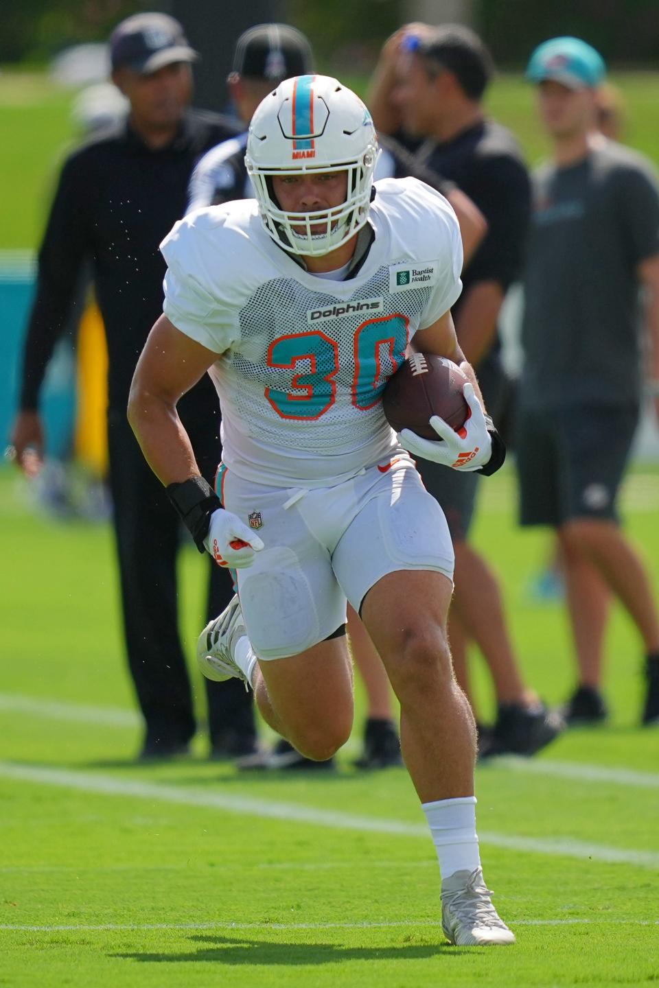 Miami Dolphins fullback Alec Ingold runs with the ball during practice at Baptist Health Training Complex. [JASEN VINLOVE/USA TODAY Sports]