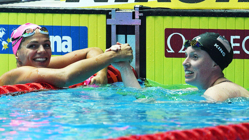 Yuliaa Efimova and Lilly King shook hands this time around at the world championships. (Photo by OLI SCARFF/AFP/Getty Images)