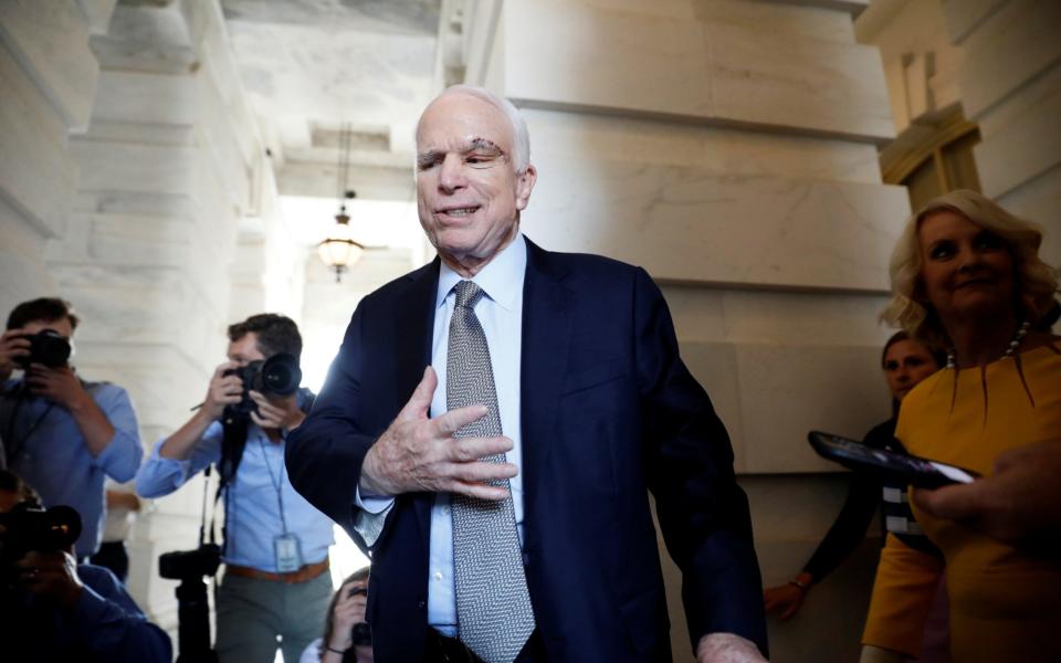 Senator John McCain (R-AZ), recently diagnosed with an aggressive form of brain cancer, departs after returning to the Senate to vote on health care legislation on Capitol Hill in Washington - Credit: Reuters