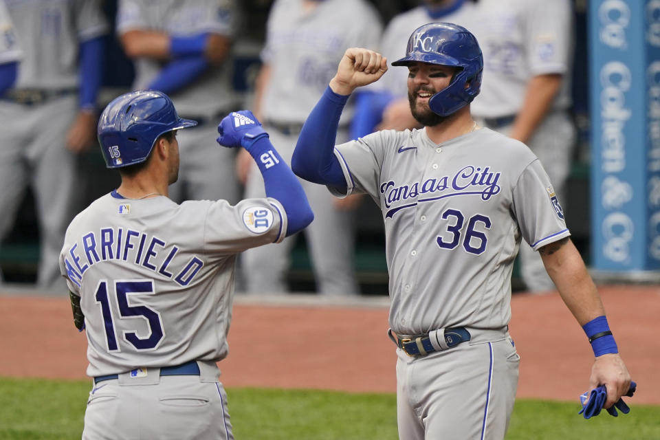 Kansas City Royals' Whit Merrifield (15) is congratulated by Cam Gallagher (36) after Merrifield hit a three-run home run during the third inning of the team's baseball game against the Cleveland Indians, Tuesday, Sept. 8, 2020, in Cleveland. (AP Photo/Tony Dejak)