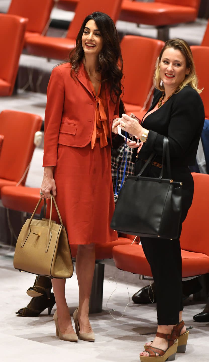 <p>Amal Clooney <a href="https://www.townandcountrymag.com/society/money-and-power/a12445266/amal-clooney-returns-to-united-nations/" rel="nofollow noopener" target="_blank" data-ylk="slk:returned to the U.N. today;elm:context_link;itc:0;sec:content-canvas" class="link ">returned to the U.N. today</a> for the first time since welcoming twins. Looking as beautiful as ever, she wore an orange blazer and skirt paired with a mandarin bowtie blouse. Her beige pointed toe pumps made the perfect finishing touch.</p>